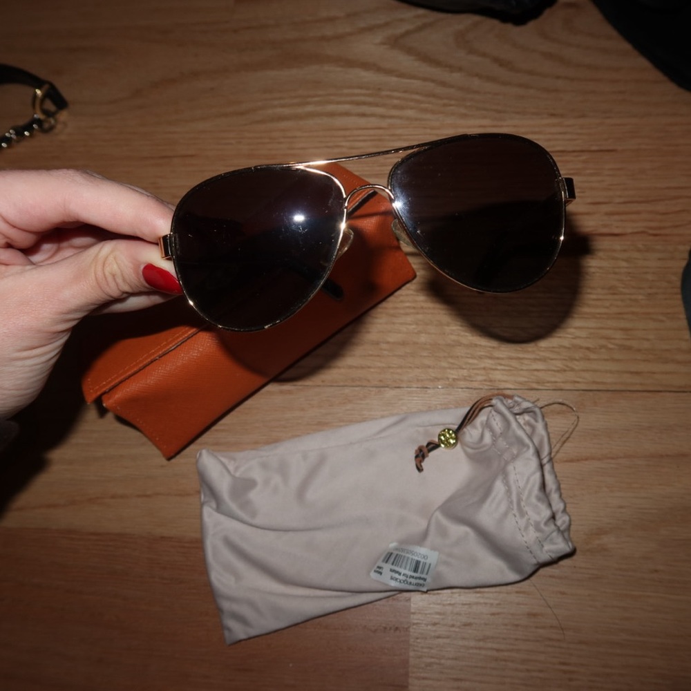 Tory Burch aviator sunglasses — comes with cover sleeve and case.